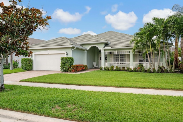 225 NW Magnolia Lakes Blvd, Port Saint Lucie, FL 34986 - single story home featuring covered porch, a garage, driveway, a front yard, and a tiled roof