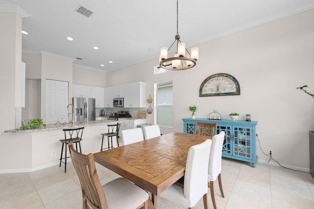 225 NW Magnolia Lakes Blvd, Port Saint Lucie, FL 34986 - dining room featuring light tile patterned floors, a chandelier, ornamental molding, recessed lighting, and baseboards