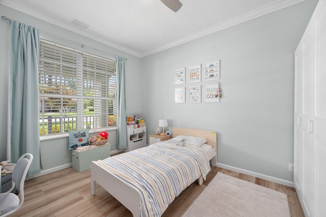 225 NW Magnolia Lakes Blvd, Port Saint Lucie, FL 34986 - bedroom featuring crown molding, wood finished floors, baseboards, and ceiling fan