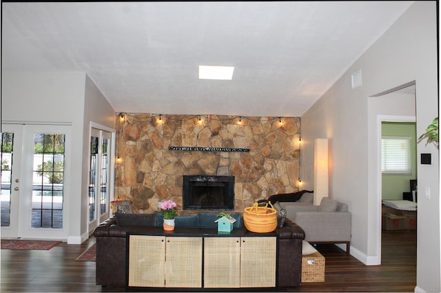 2182 SE Bersell Rd, Port Saint Lucie, FL 34952 - living room featuring healthy amount of natural light, wood finished floors, a fireplace, and french doors