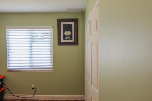2182 SE Bersell Rd, Port Saint Lucie, FL 34952 - bathroom featuring baseboards and wood finished floors