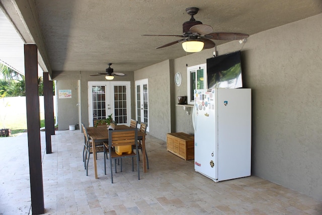 2182 SE Bersell Rd, Port Saint Lucie, FL 34952 - view of patio / terrace with french doors, ceiling fan, and outdoor dining area