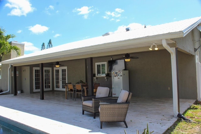 2182 SE Bersell Rd, Port Saint Lucie, FL 34952 - back of house featuring french doors, a ceiling fan, a patio, and stucco siding