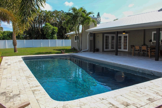 2182 SE Bersell Rd, Port Saint Lucie, FL 34952 - view of swimming pool featuring french doors, ceiling fan, and a patio area