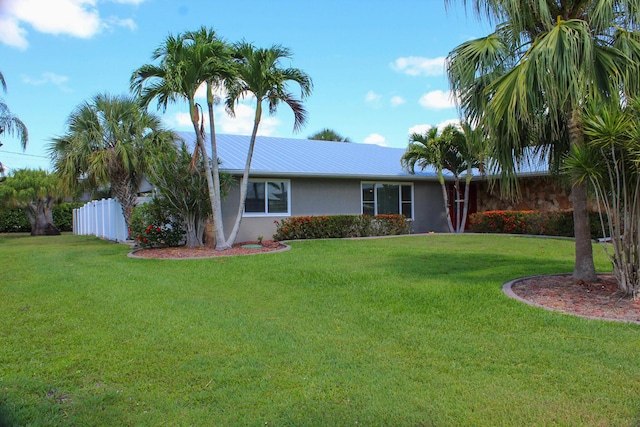 2182 SE Bersell Rd, Port Saint Lucie, FL 34952 - view of front of home with stucco siding and metal roof