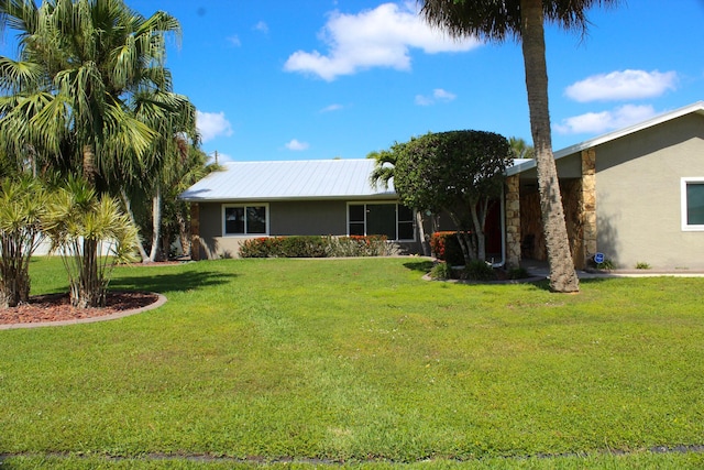 2182 SE Bersell Rd, Port Saint Lucie, FL 34952 - view of front of property with stucco siding and a front lawn