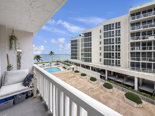 3570 S Ocean Blvd Unit 506, South Palm Beach, FL 33480 - balcony with a water view and view of pool