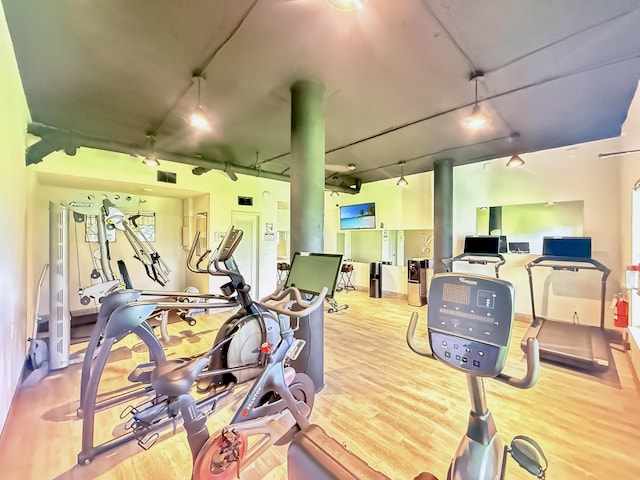 3570 S Ocean Blvd Unit 506, South Palm Beach, FL 33480 - gym featuring track lighting and wood finished floors