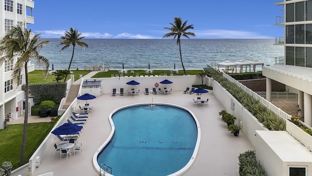 3570 S Ocean Blvd Unit 506, South Palm Beach, FL 33480 - community pool featuring a water view and a patio area