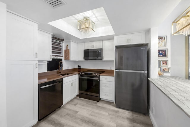 3570 S Ocean Blvd Unit 506, South Palm Beach, FL 33480 - kitchen with freestanding refrigerator, electric stove, dishwasher, a sink, and white cabinets