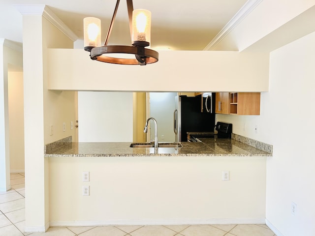 6511 Emerald Dunes Dr Unit 308, West Palm Beach, FL 33411 - kitchen featuring black range oven, a sink, ornamental molding, light stone counters, and a peninsula