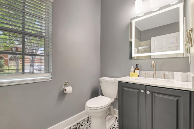 9800 Stover Way, Wellington, FL 33414 - bathroom featuring baseboards, toilet, vanity, and tile patterned floors