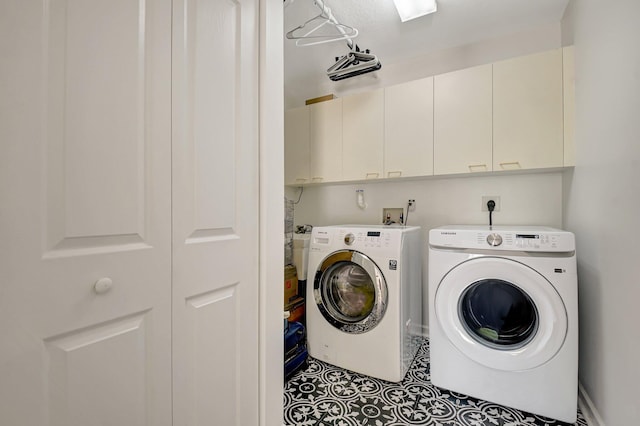 9800 Stover Way, Wellington, FL 33414 - washroom featuring cabinet space, tile patterned flooring, and washing machine and clothes dryer