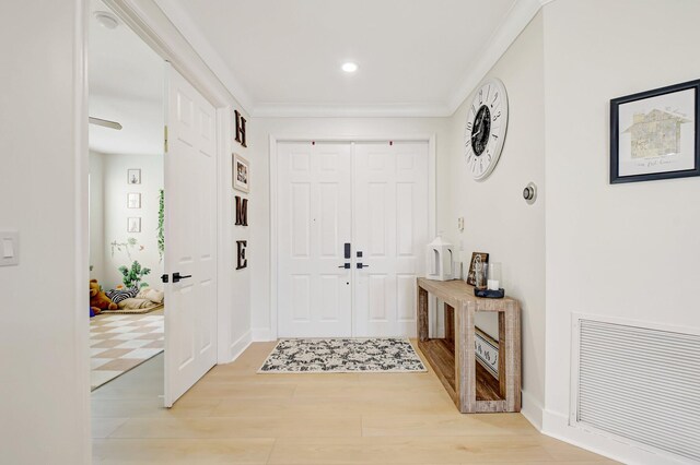 9800 Stover Way, Wellington, FL 33414 - entryway with light wood finished floors, recessed lighting, ornamental molding, and baseboards