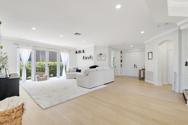 9800 Stover Way, Wellington, FL 33414 - living room with ornamental molding, arched walkways, recessed lighting, light wood-style flooring, and french doors