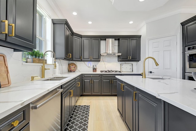 9800 Stover Way, Wellington, FL 33414 - kitchen featuring stainless steel appliances, wall chimney exhaust hood, a sink, light stone countertops, and backsplash
