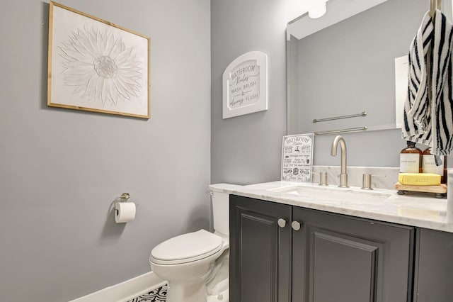 9800 Stover Way, Wellington, FL 33414 - half bathroom with vanity, toilet, and baseboards