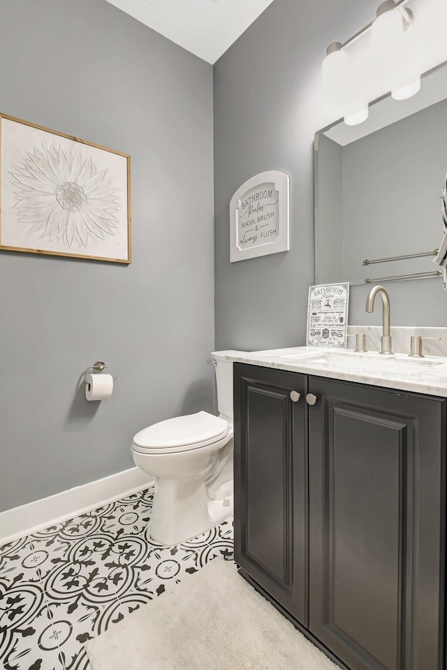 9800 Stover Way, Wellington, FL 33414 - half bathroom featuring toilet, vanity, and baseboards