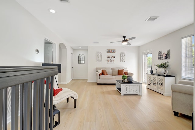 9800 Stover Way, Wellington, FL 33414 - living room featuring a ceiling fan, light wood-style flooring, arched walkways, recessed lighting, and baseboards
