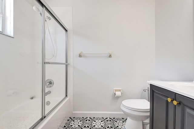 9800 Stover Way, Wellington, FL 33414 - full bathroom with toilet, tile patterned floors, vanity, shower / bath combination with glass door, and baseboards