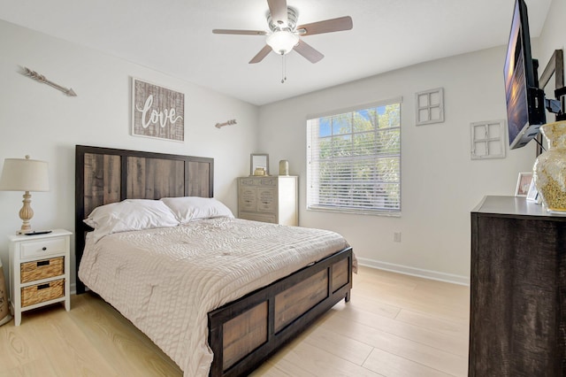 9800 Stover Way, Wellington, FL 33414 - bedroom featuring baseboards, light wood-type flooring, and a ceiling fan
