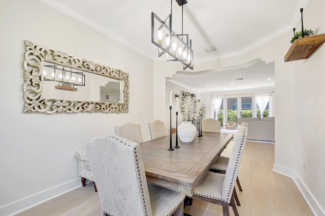 9800 Stover Way, Wellington, FL 33414 - dining room with a chandelier, ornamental molding, light wood-type flooring, and baseboards