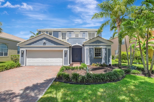 9800 Stover Way, Wellington, FL 33414 - view of front facade with decorative driveway, a garage, stucco siding, a tiled roof, and a front lawn