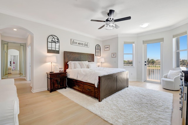 9800 Stover Way, Wellington, FL 33414 - bedroom featuring access to outside, arched walkways, light wood finished floors, ornamental molding, and baseboards