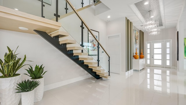 13206 Faberge Pl, Palm Beach Gardens, FL 33418 - entrance foyer featuring baseboards, stairs, a chandelier, and a towering ceiling