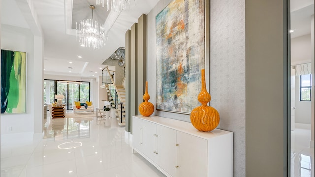 13206 Faberge Pl, Palm Beach Gardens, FL 33418 - hall with light tile patterned flooring, a chandelier, stairs, and recessed lighting