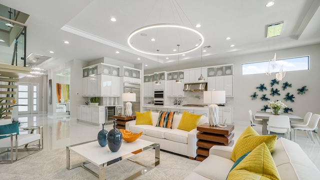 13206 Faberge Pl, Palm Beach Gardens, FL 33418 - living area featuring a raised ceiling, a chandelier, wine cooler, and recessed lighting