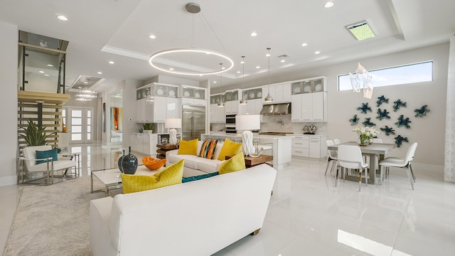 13206 Faberge Pl, Palm Beach Gardens, FL 33418 - living area featuring a raised ceiling, recessed lighting, and light tile patterned floors