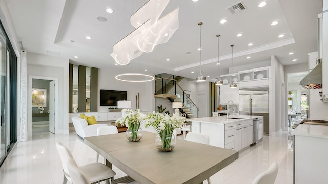 13206 Faberge Pl, Palm Beach Gardens, FL 33418 - dining area featuring a raised ceiling, light tile patterned flooring, stairs, and recessed lighting
