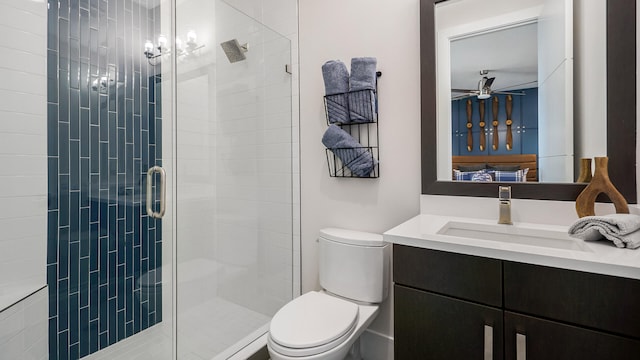 13206 Faberge Pl, Palm Beach Gardens, FL 33418 - bathroom with a shower stall, a ceiling fan, toilet, and vanity