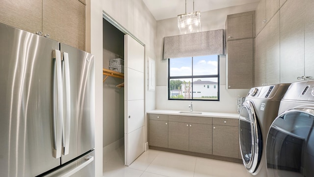 13206 Faberge Pl, Palm Beach Gardens, FL 33418 - laundry room featuring washer and dryer and light tile patterned flooring