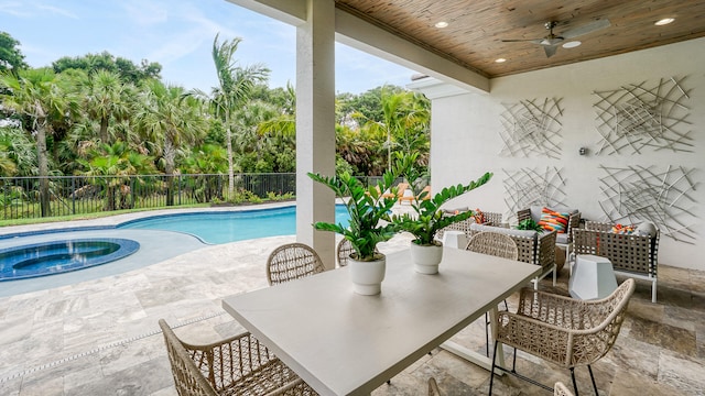 13206 Faberge Pl, Palm Beach Gardens, FL 33418 - view of pool with a ceiling fan, an in-ground hot tub, a fenced backyard, a patio area, and outdoor dining space