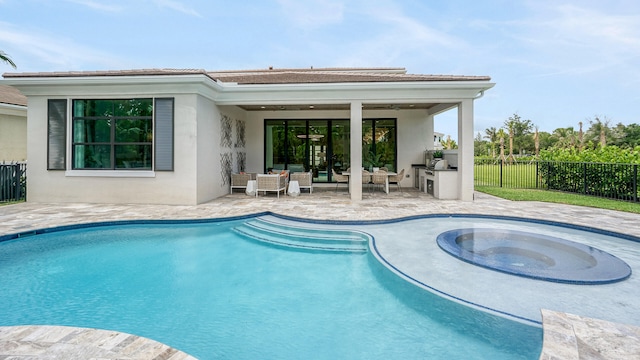 13206 Faberge Pl, Palm Beach Gardens, FL 33418 - view of pool with a patio area, an outdoor kitchen, outdoor lounge area, and an in-ground hot tub