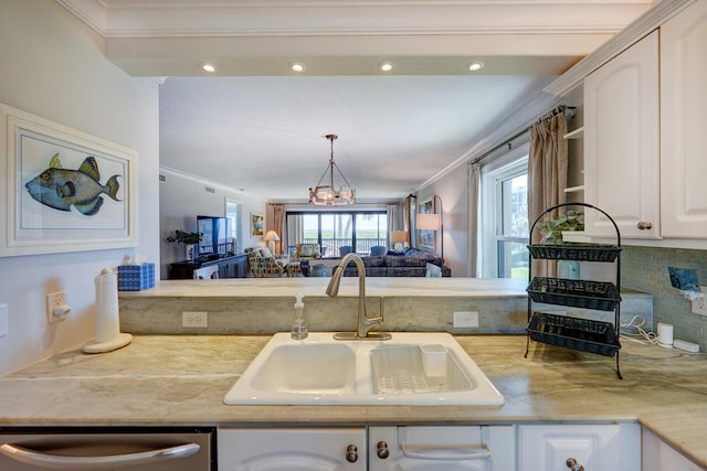 2641 NE Ocean Blvd Unit 106, Stuart, FL 34996 - kitchen with a sink, ornamental molding, dishwasher, white cabinetry, and decorative backsplash