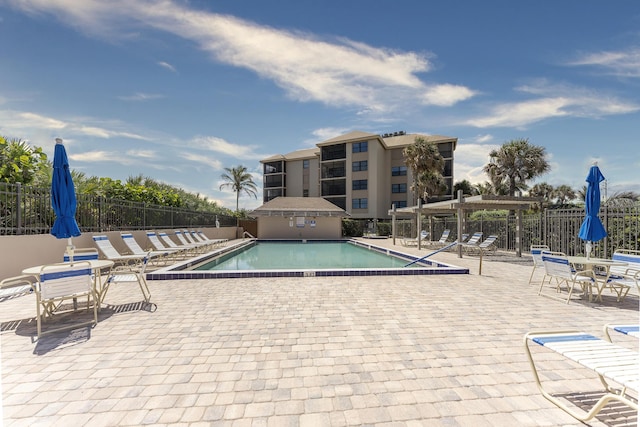 2641 NE Ocean Blvd Unit 106, Stuart, FL 34996 - community pool featuring a patio area and a pergola