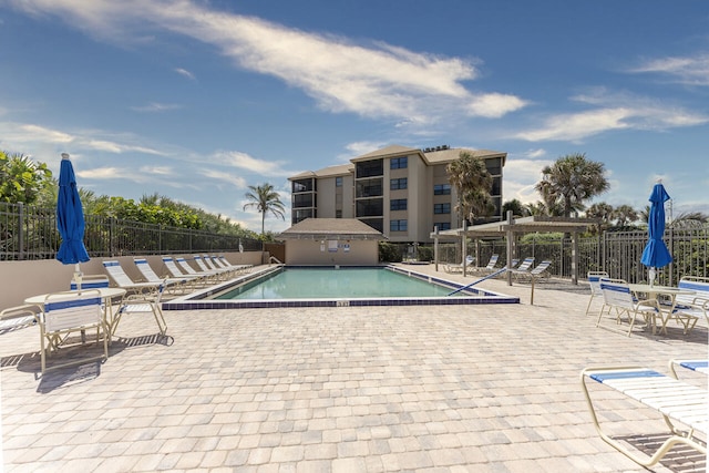 2641 NE Ocean Blvd Unit 106, Stuart, FL 34996 - view of swimming pool featuring a patio