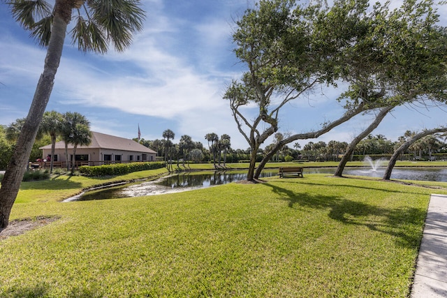 2641 NE Ocean Blvd Unit 106, Stuart, FL 34996 - view of community with a water view and a yard