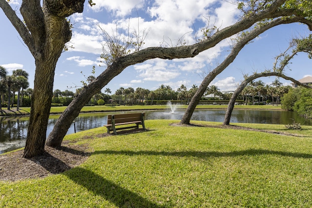 2641 NE Ocean Blvd Unit 106, Stuart, FL 34996 - surrounding community with a water view and a lawn