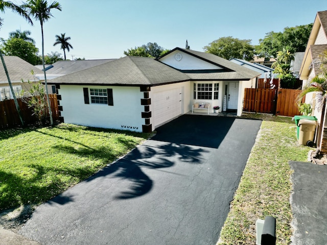 8421 SW 41st Ct, Davie, FL 33328 - single story home featuring stucco siding, asphalt driveway, a garage, and a shingled roof