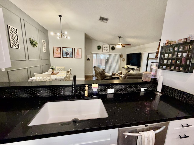 8421 SW 41st Ct, Davie, FL 33328 - kitchen with lofted ceiling, a sink, a ceiling fan, dishwasher, and dark stone counters