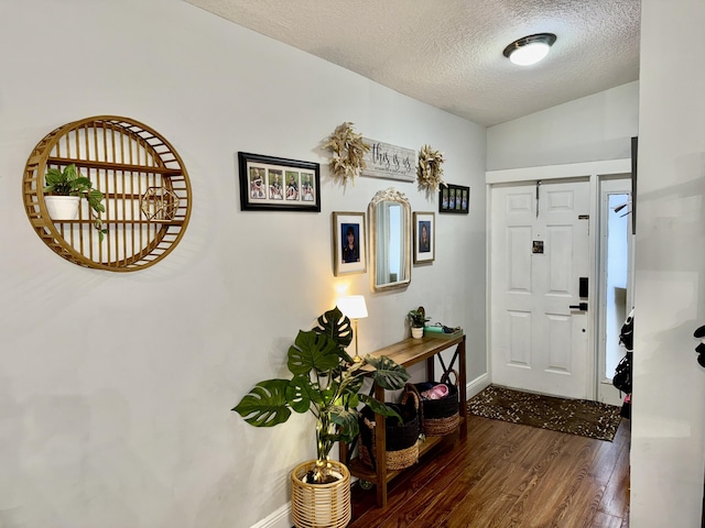 8421 SW 41st Ct, Davie, FL 33328 - foyer entrance featuring wood finished floors, a textured ceiling, and baseboards