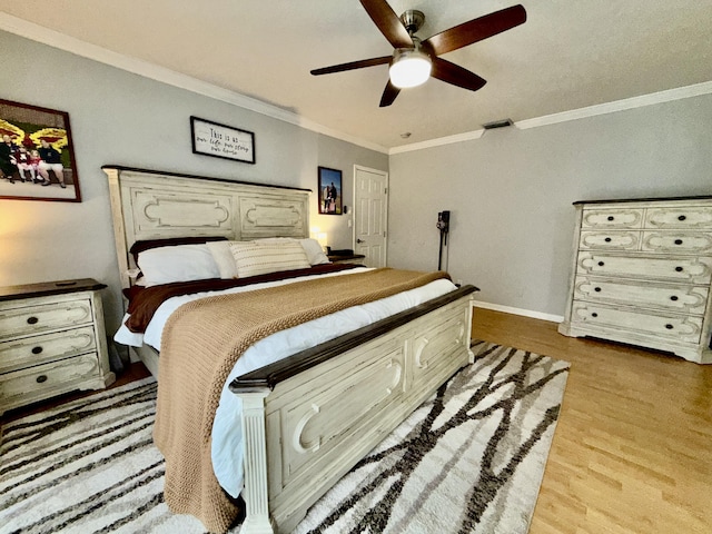 8421 SW 41st Ct, Davie, FL 33328 - bedroom with wood finished floors, crown molding, baseboards, and a ceiling fan