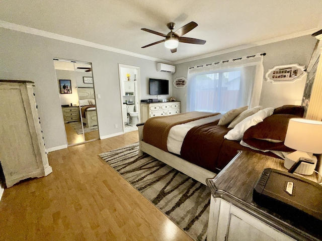 8421 SW 41st Ct, Davie, FL 33328 - bedroom featuring a wall unit AC, wood finished floors, ornamental molding, ensuite bath, and ceiling fan