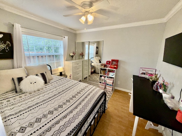 8421 SW 41st Ct, Davie, FL 33328 - bedroom featuring crown molding, baseboards, light wood-type flooring, and ceiling fan
