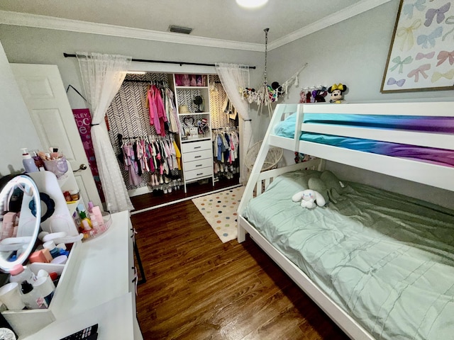 8421 SW 41st Ct, Davie, FL 33328 - bedroom with ornamental molding, wood finished floors, and a closet