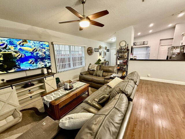 8421 SW 41st Ct, Davie, FL 33328 - living area with lofted ceiling, a ceiling fan, wood finished floors, and baseboards